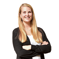 Headshot of Ali Chiavetta, a white woman with blonde hair, smiling and crossing her arms