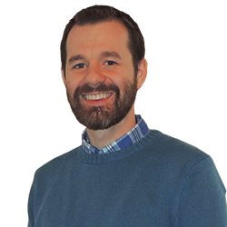 Headshot of Brian Petrosky. Smiling, white middle-aged male with a beard.