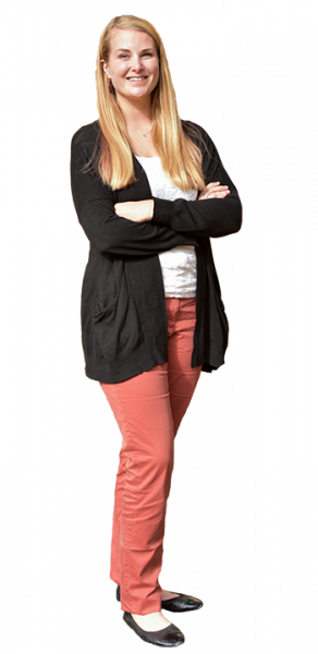 Ali Rill, a white woman with blonde hair, smiling and standing with crossed arms