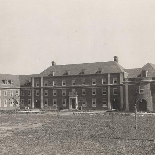 The Grange Memorial Dormitory circa 1929, three-story brick building in sepia tone photograph
