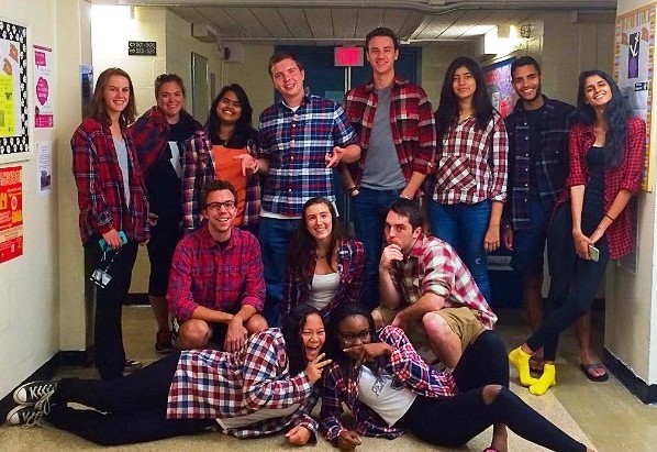 photo of FA15 Discover House residents in red flannel shirts